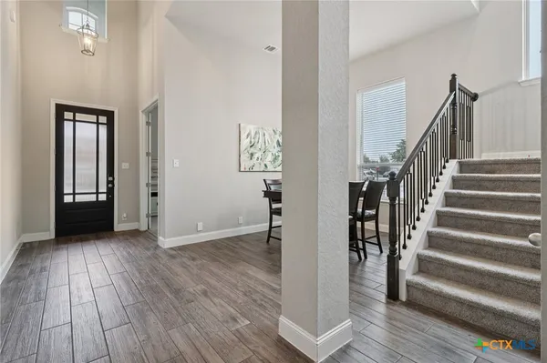 a view of entryway with wooden floor