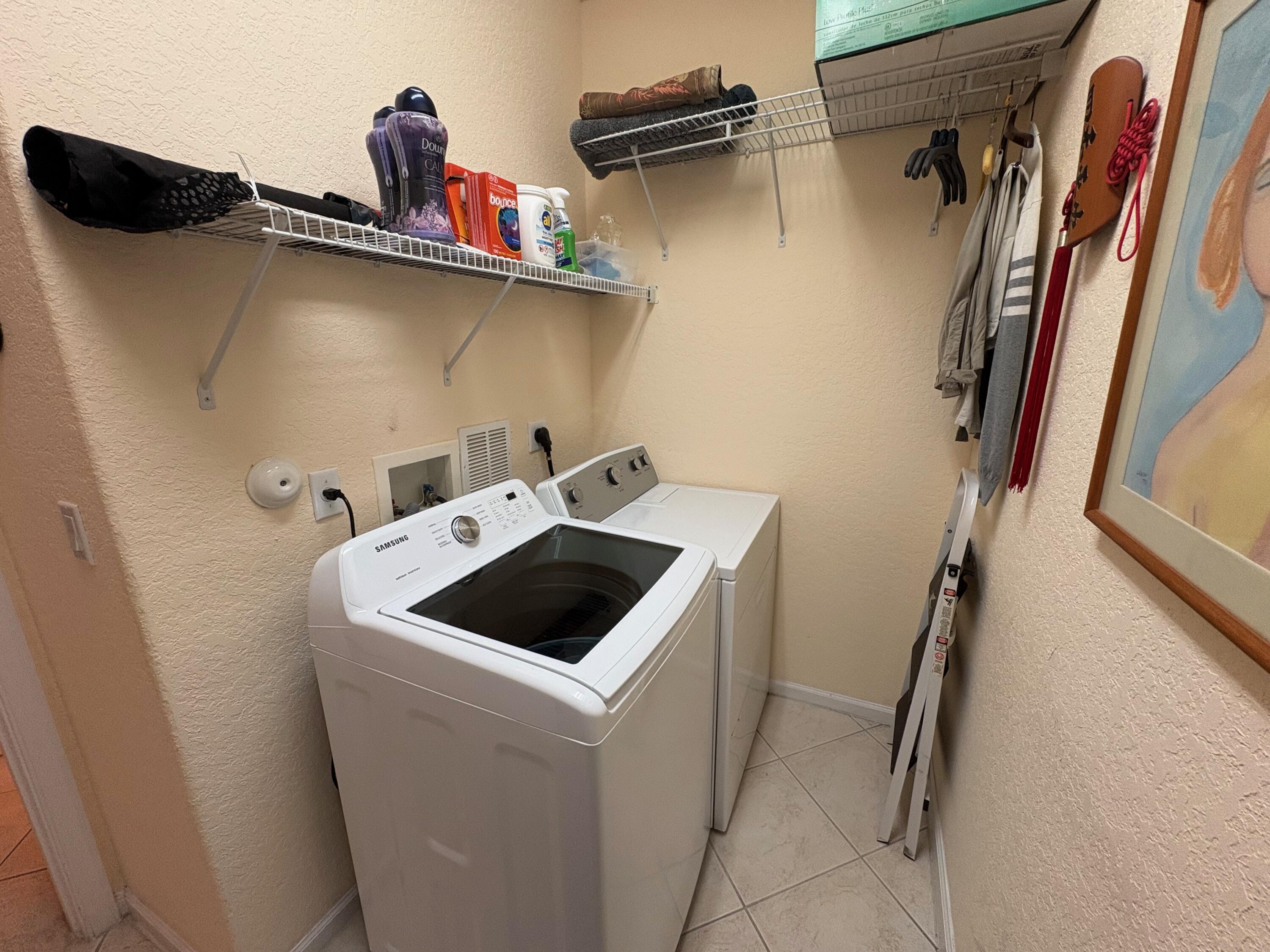 67 Legacy Court Delray Beach, FL 33445 - Photo 13 of 13 a utility room with dryer and washer