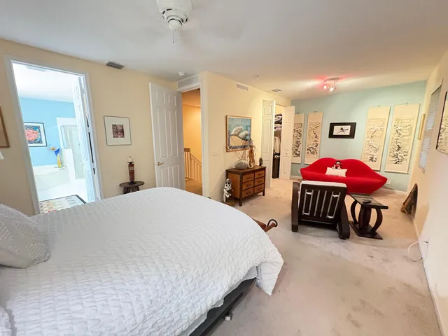 a bedroom with a bed and a table