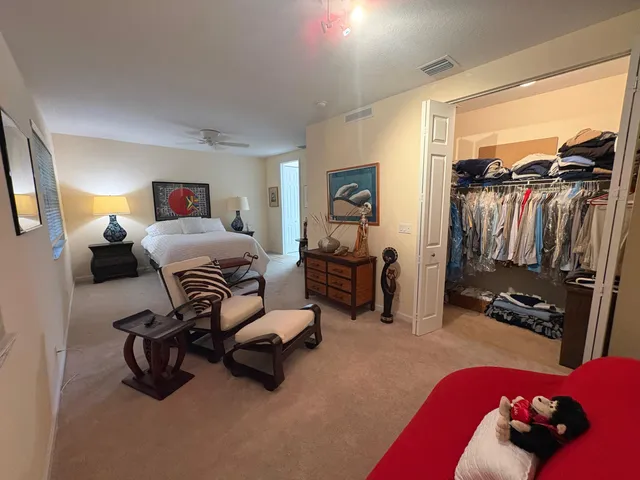 a bedroom with furniture a bed and a window