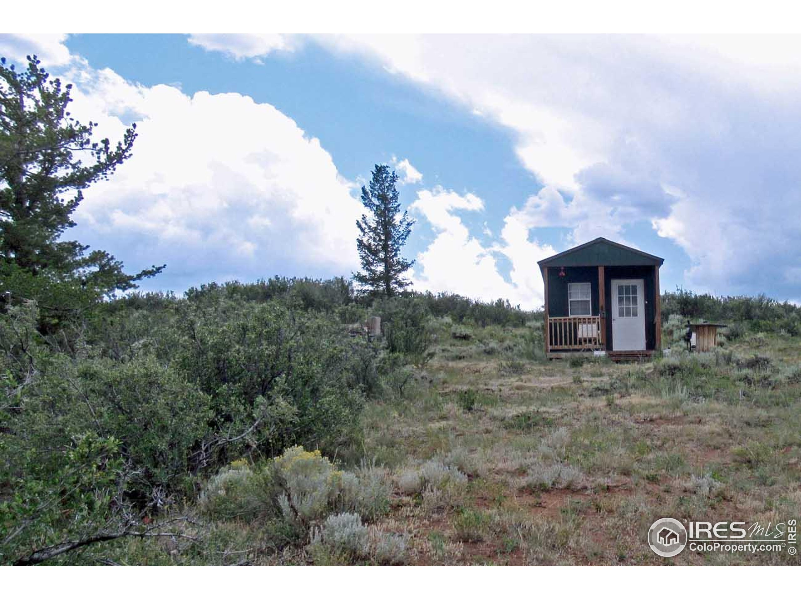Undisclosed Address Livermore, CO 80536 - Photo 11 of 17 a view of a barn in the middle of a field