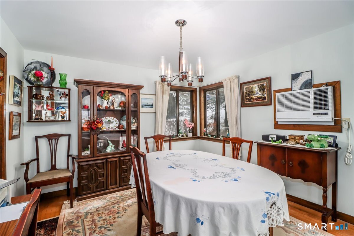 5 Western View Road New Milford, CT 06776 - Photo 11 of 36 a view of a dining room with furniture and chandelier