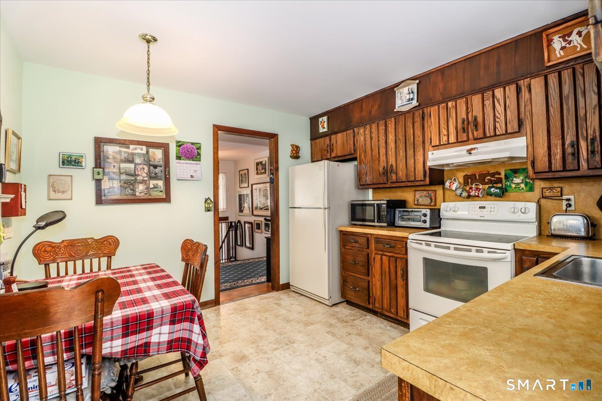 5 Western View Road New Milford, CT 06776 - Photo 13 of 36 a kitchen with a refrigerator and a stove top oven