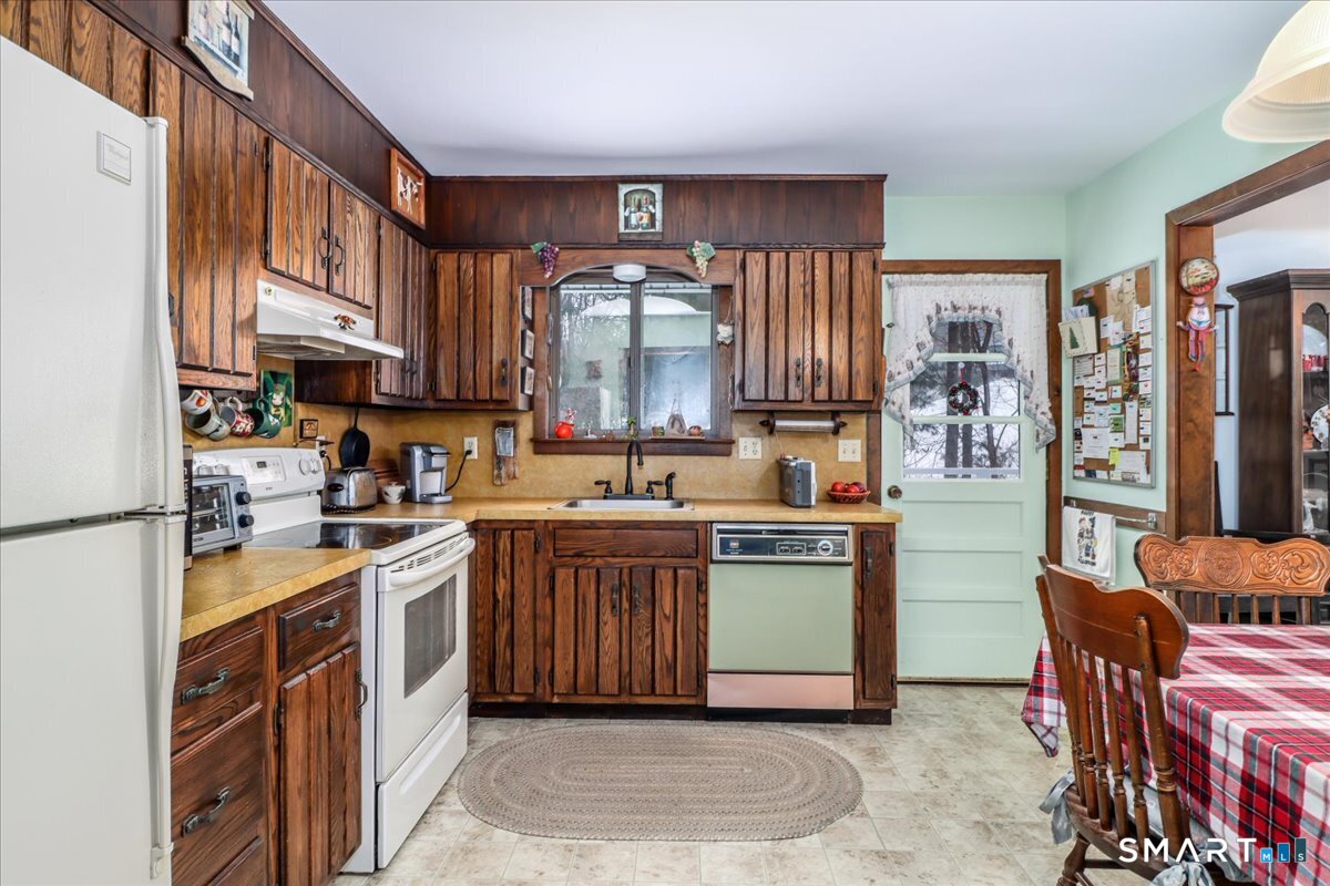 5 Western View Road New Milford, CT 06776 - Photo 15 of 36 a kitchen with stainless steel appliances granite countertop a stove a sink dishwasher and a refrigerator
