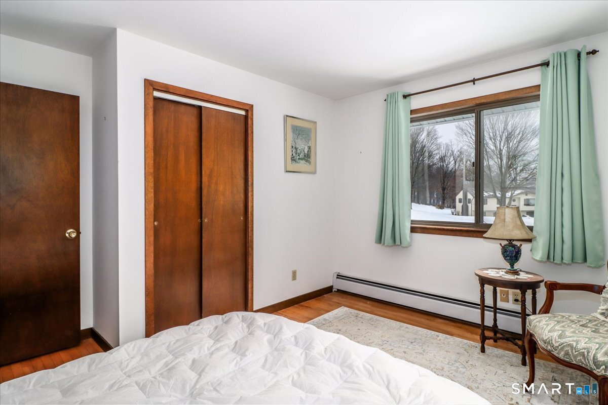 5 Western View Road New Milford, CT 06776 - Photo 22 of 36 a bedroom with a bed and a window