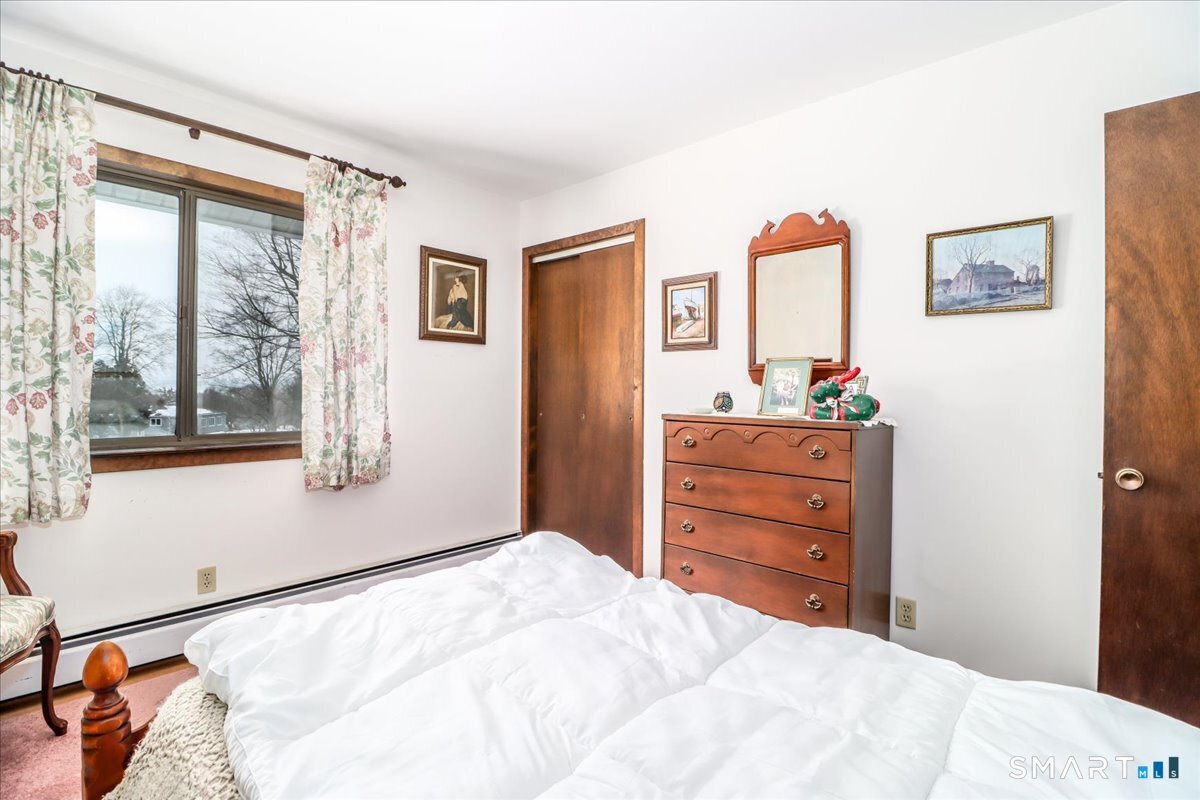 5 Western View Road New Milford, CT 06776 - Photo 23 of 36 a bedroom with a bed and a dresser