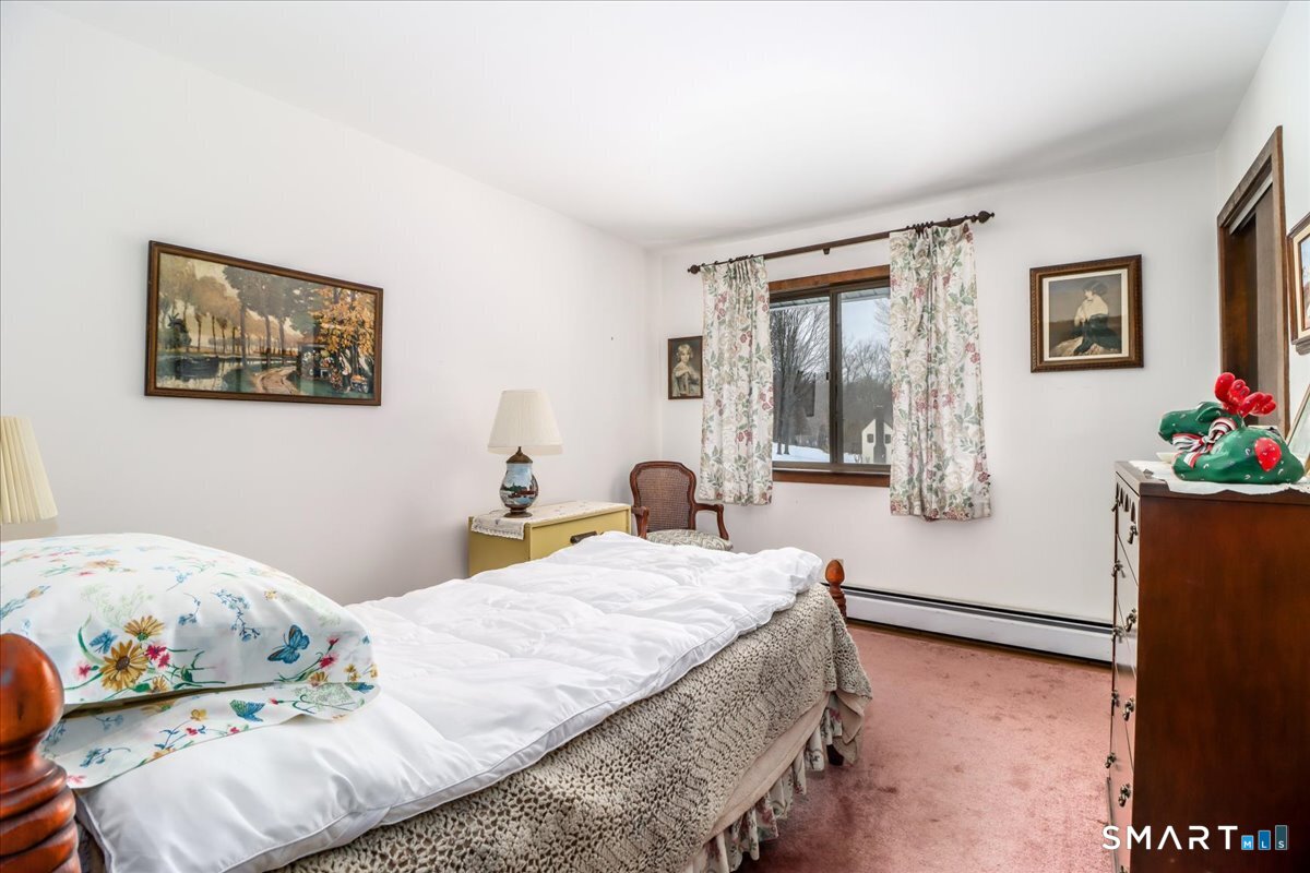 5 Western View Road New Milford, CT 06776 - Photo 24 of 36 a bedroom with a bed and a large window