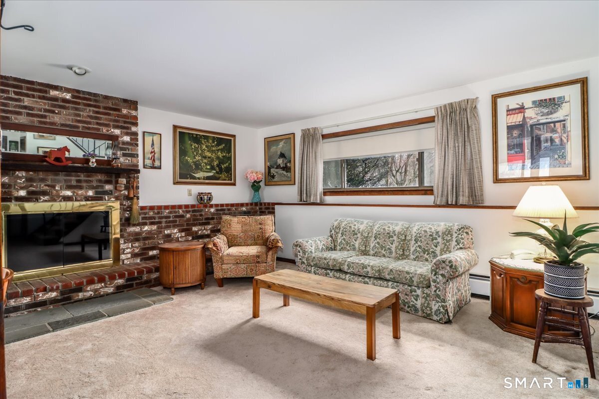 5 Western View Road New Milford, CT 06776 - Photo 28 of 36 a living room with furniture a rug and a fireplace