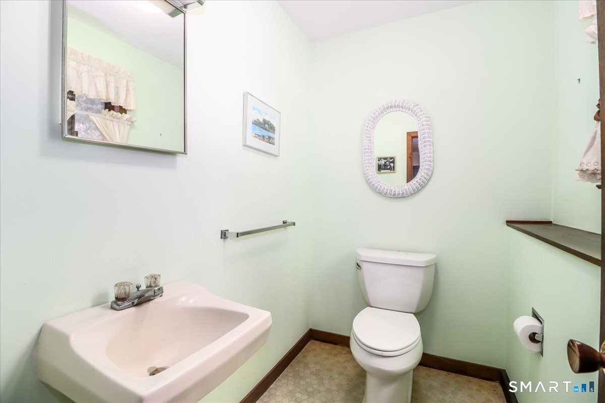 5 Western View Road New Milford, CT 06776 - Photo 33 of 36 a bathroom with a toilet sink and mirror