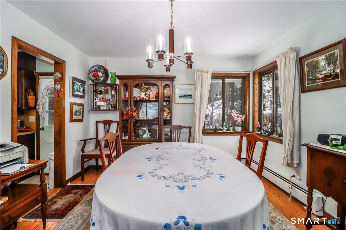 5 Western View Road New Milford, CT 06776 - Photo 10 of 36 a view of a dining room with furniture window and wooden floor