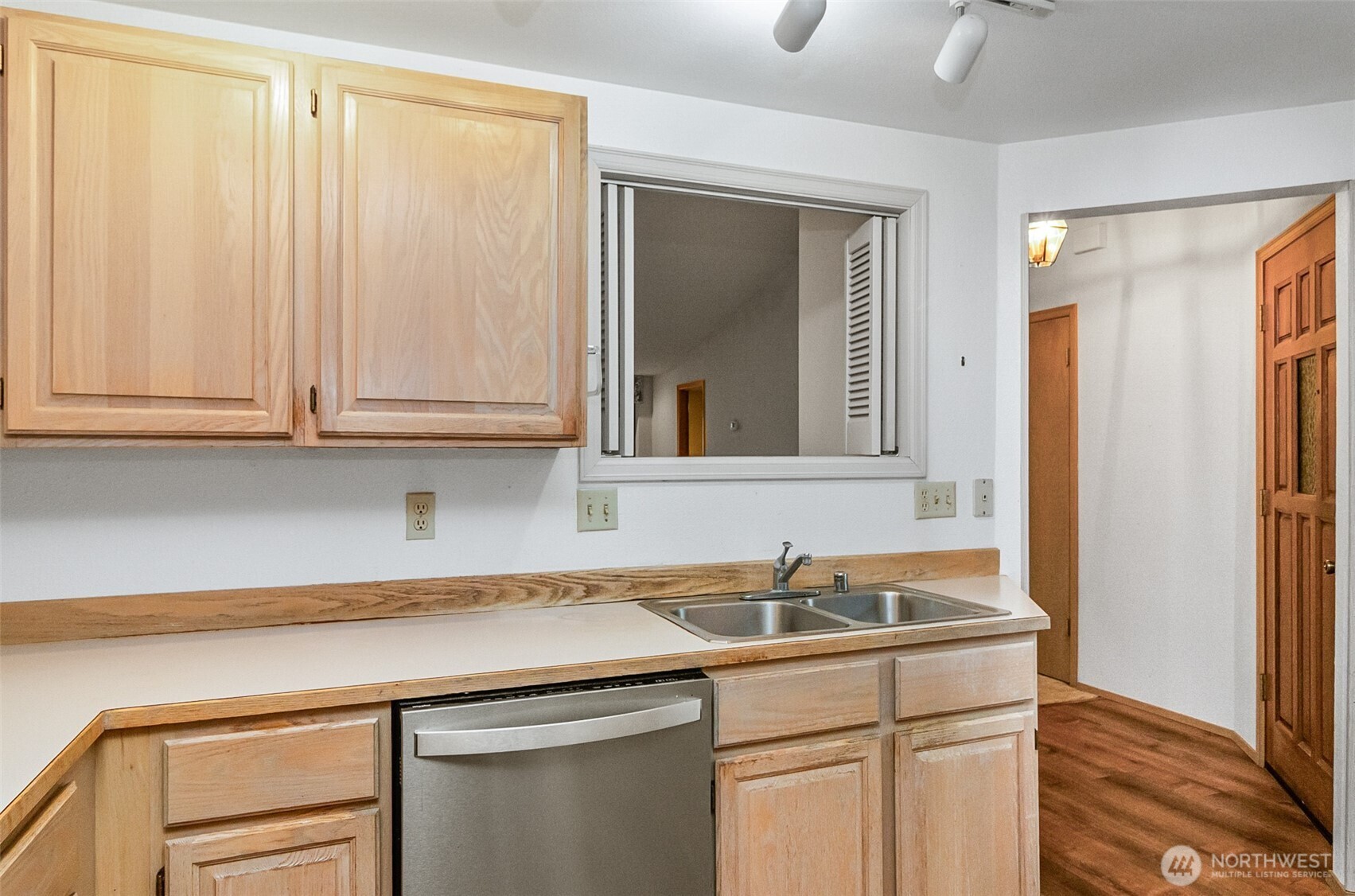 1310 Boise Street Fircrest, WA 98466 - Photo 12 of 36 a kitchen with stainless steel appliances white cabinets and a sink