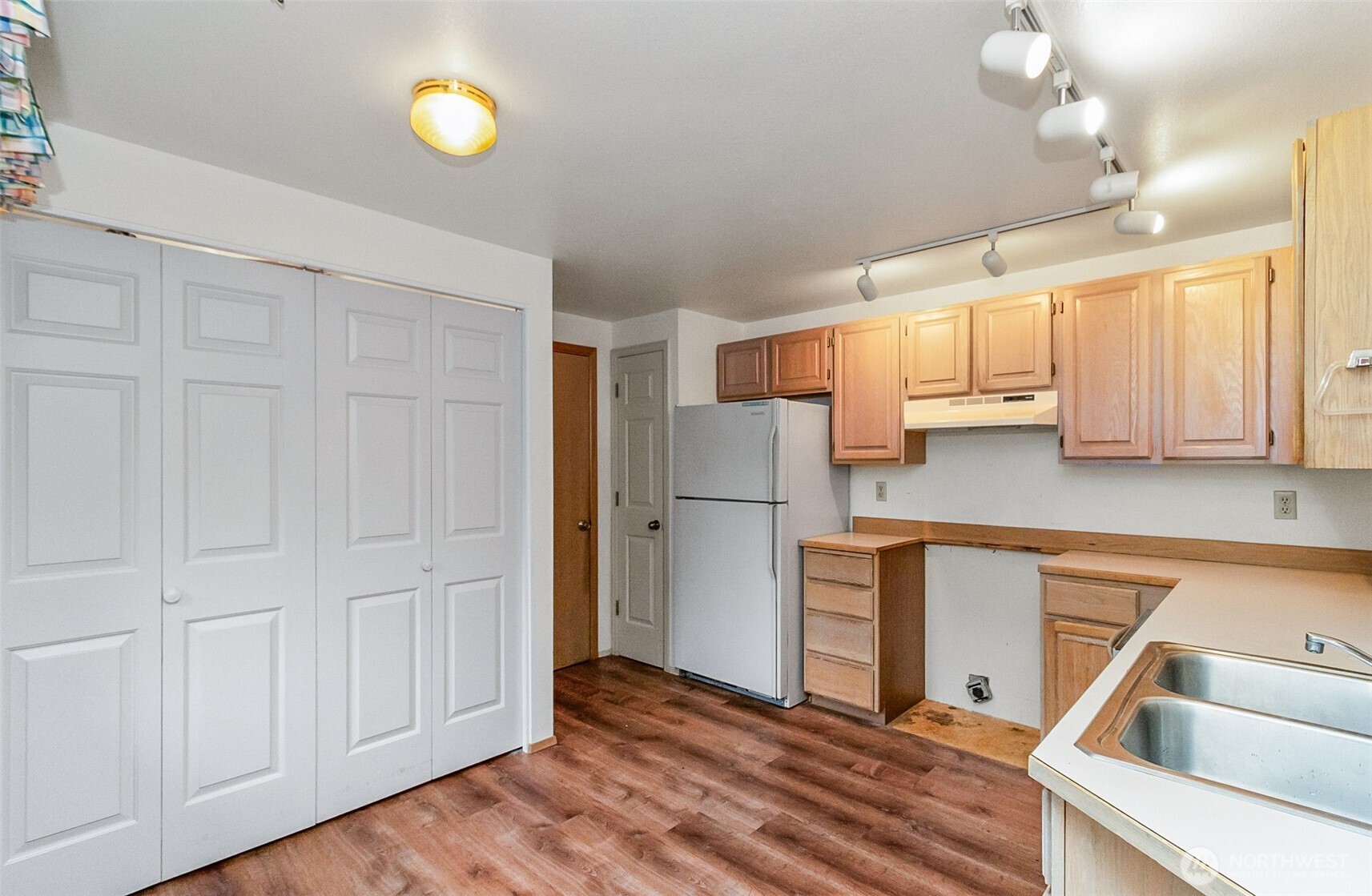 1310 Boise Street Fircrest, WA 98466 - Photo 13 of 36 a kitchen with a refrigerator and a sink
