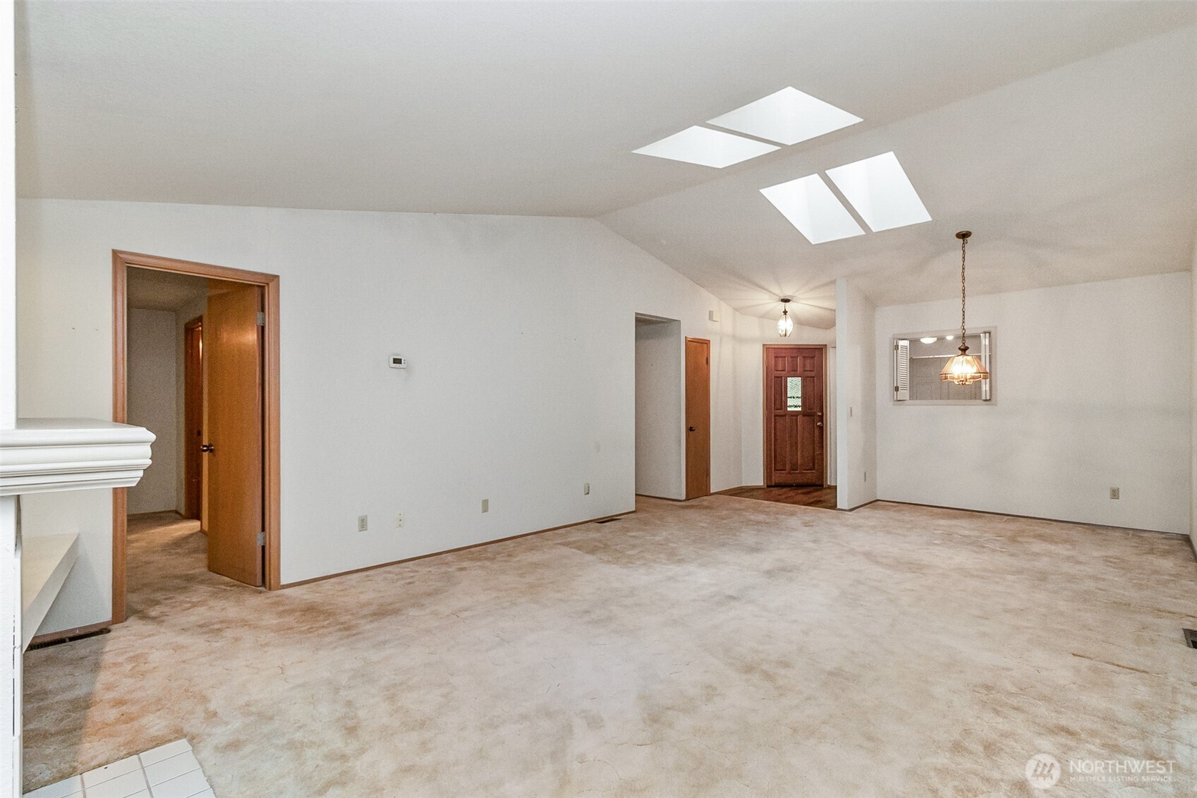 1310 Boise Street Fircrest, WA 98466 - Photo 19 of 36 an empty room with entrance and windows