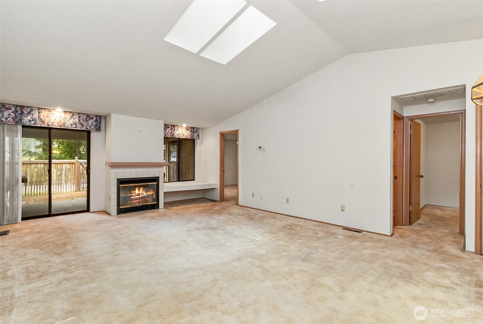 1310 Boise Street Fircrest, WA 98466 - Photo 20 of 36 an empty room with furniture and a fireplace