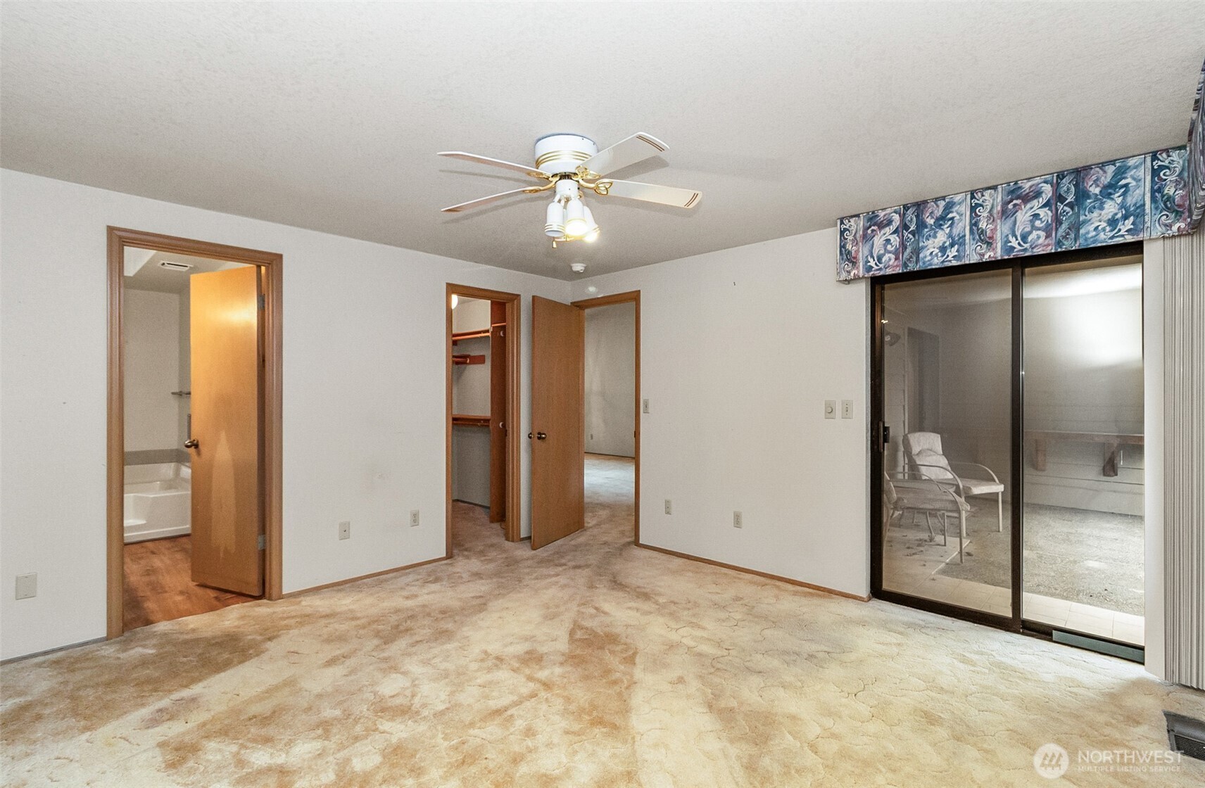 1310 Boise Street Fircrest, WA 98466 - Photo 27 of 36 an empty room with closet and a chandelier fan