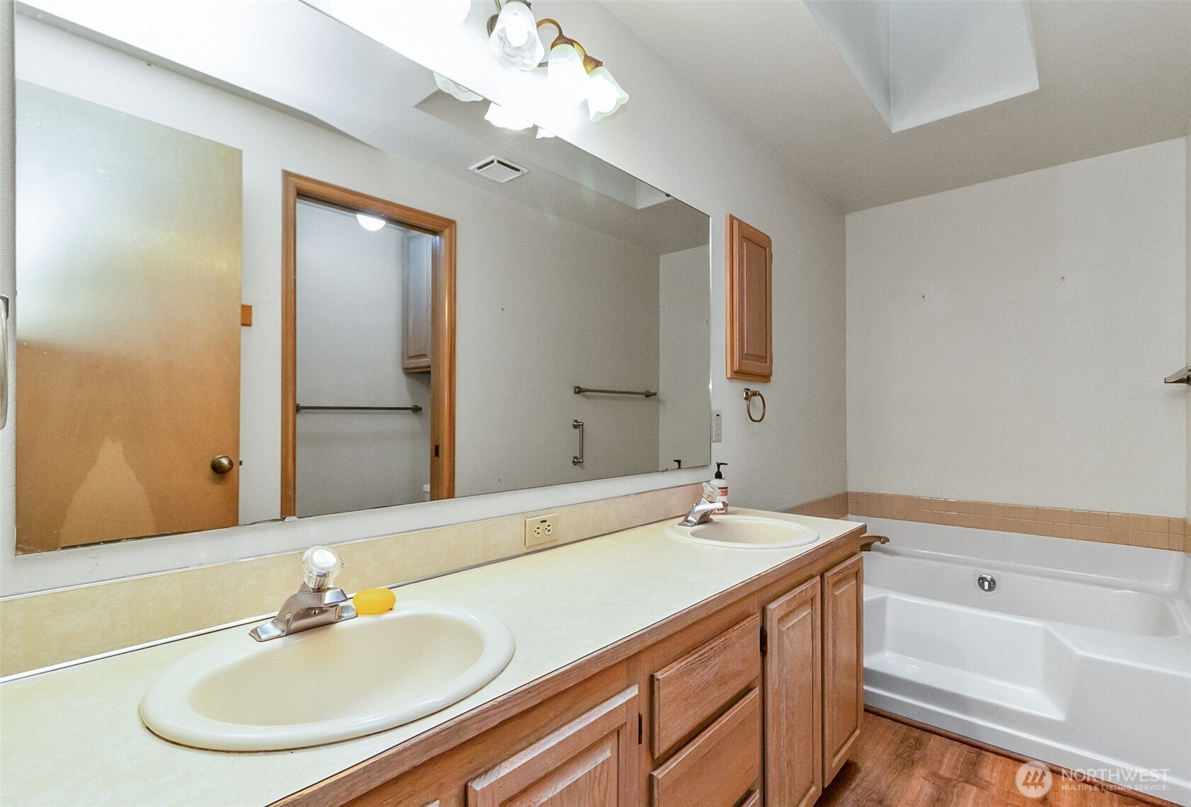 1310 Boise Street Fircrest, WA 98466 - Photo 32 of 36 a bathroom with a sink double vanity granite tub and a mirror