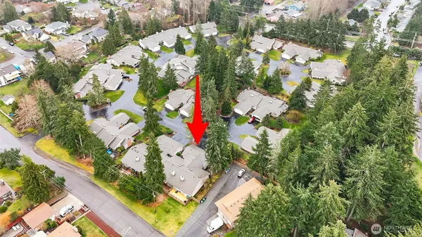 an aerial view of a house with a yard basket ball court