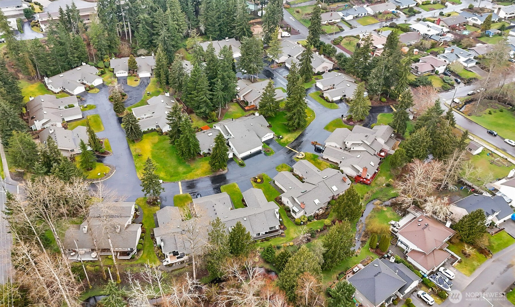 1310 Boise Street Fircrest, WA 98466 - Photo 9 of 36 an aerial view of residential house with swimming pool and lawn chairs