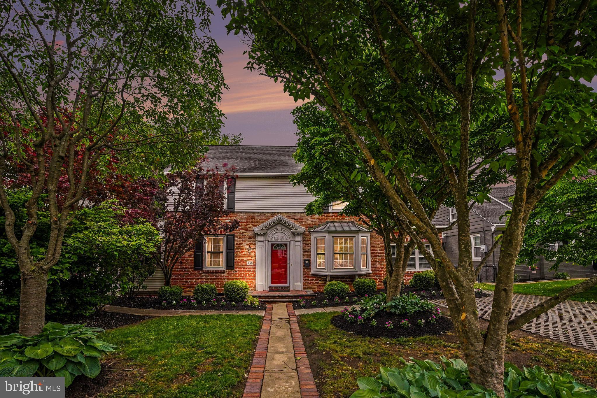 235 Hopkins Road Haddonfield, NJ 08033 - Photo 3 of 47 a front view of a house with a yard