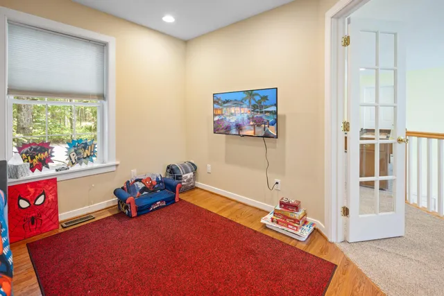 a bed room with a bed and a window