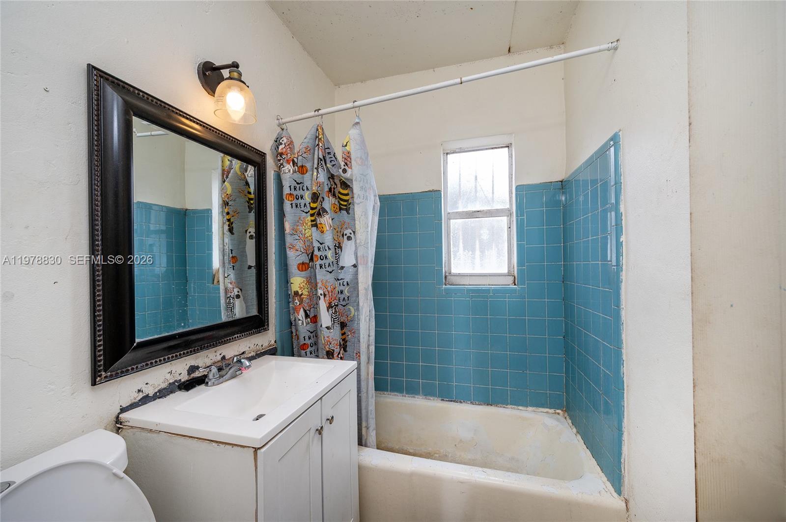 1101 Southwest 2nd Street Homestead, FL 33030 - Photo 17 of 17 a bathroom with a sink mirror toilet and bathtub