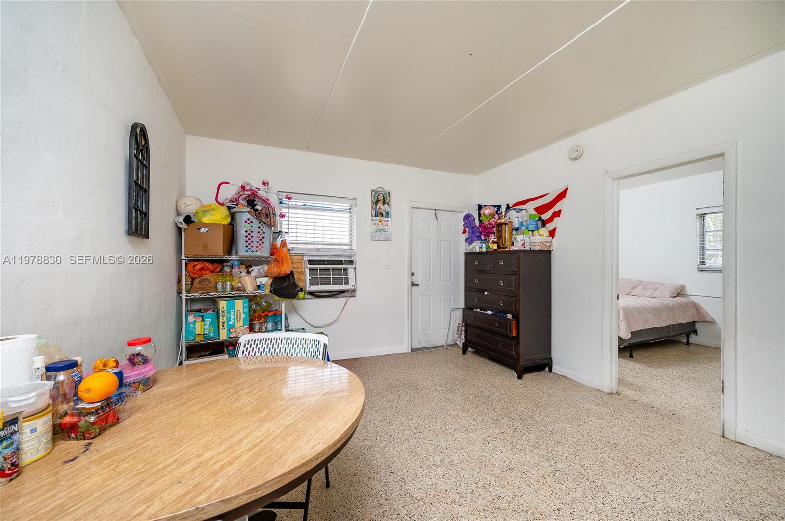1101 Southwest 2nd Street Homestead, FL 33030 - Photo 8 of 17 a bed room with a bed and a desk