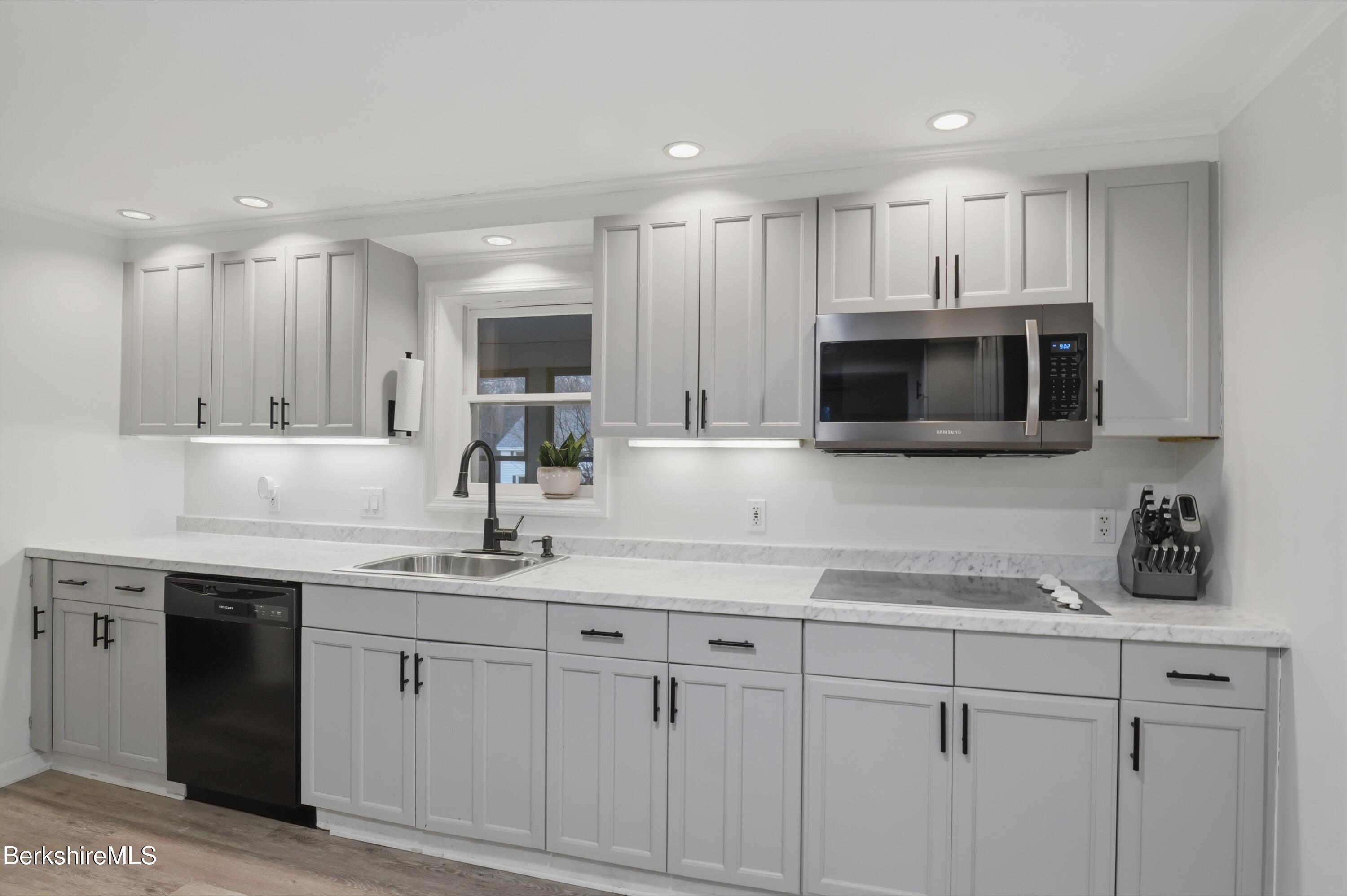 117 Norfolk Road New Marlborough, MA 01259 - Photo 14 of 59 a kitchen with a sink stainless steel appliances and cabinets