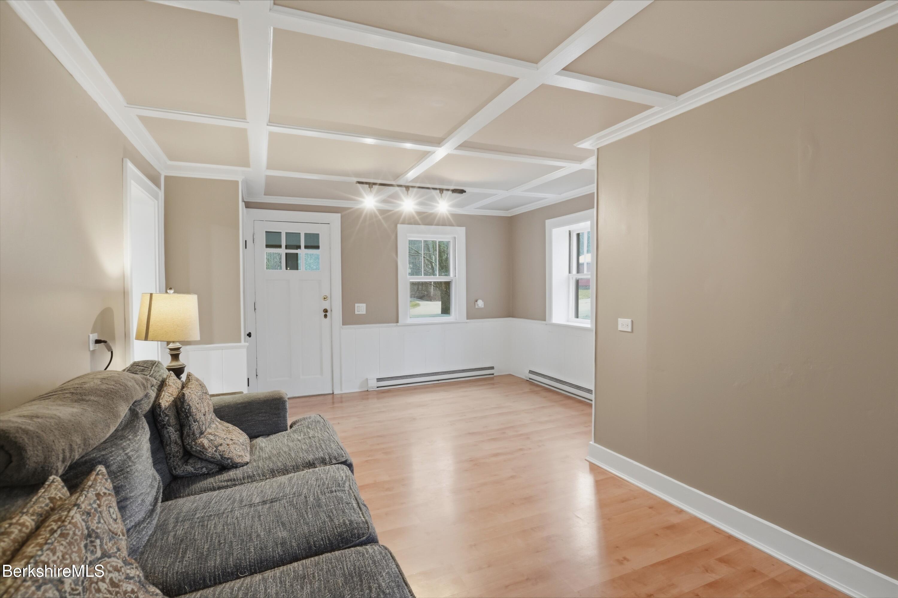 117 Norfolk Road New Marlborough, MA 01259 - Photo 17 of 59 a living room with furniture and a lamp