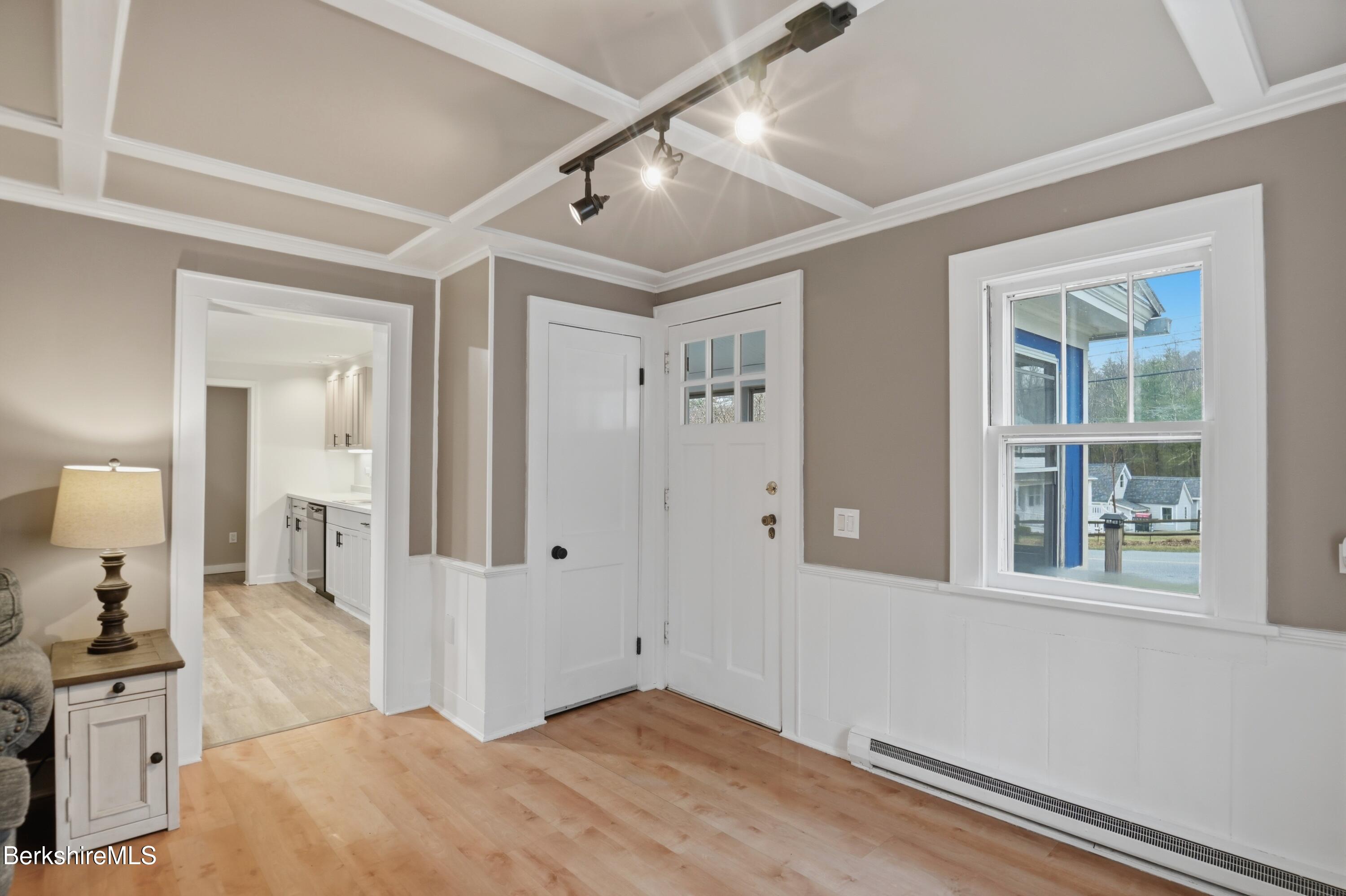 117 Norfolk Road New Marlborough, MA 01259 - Photo 20 of 59 a bedroom with a large bed and chandelier