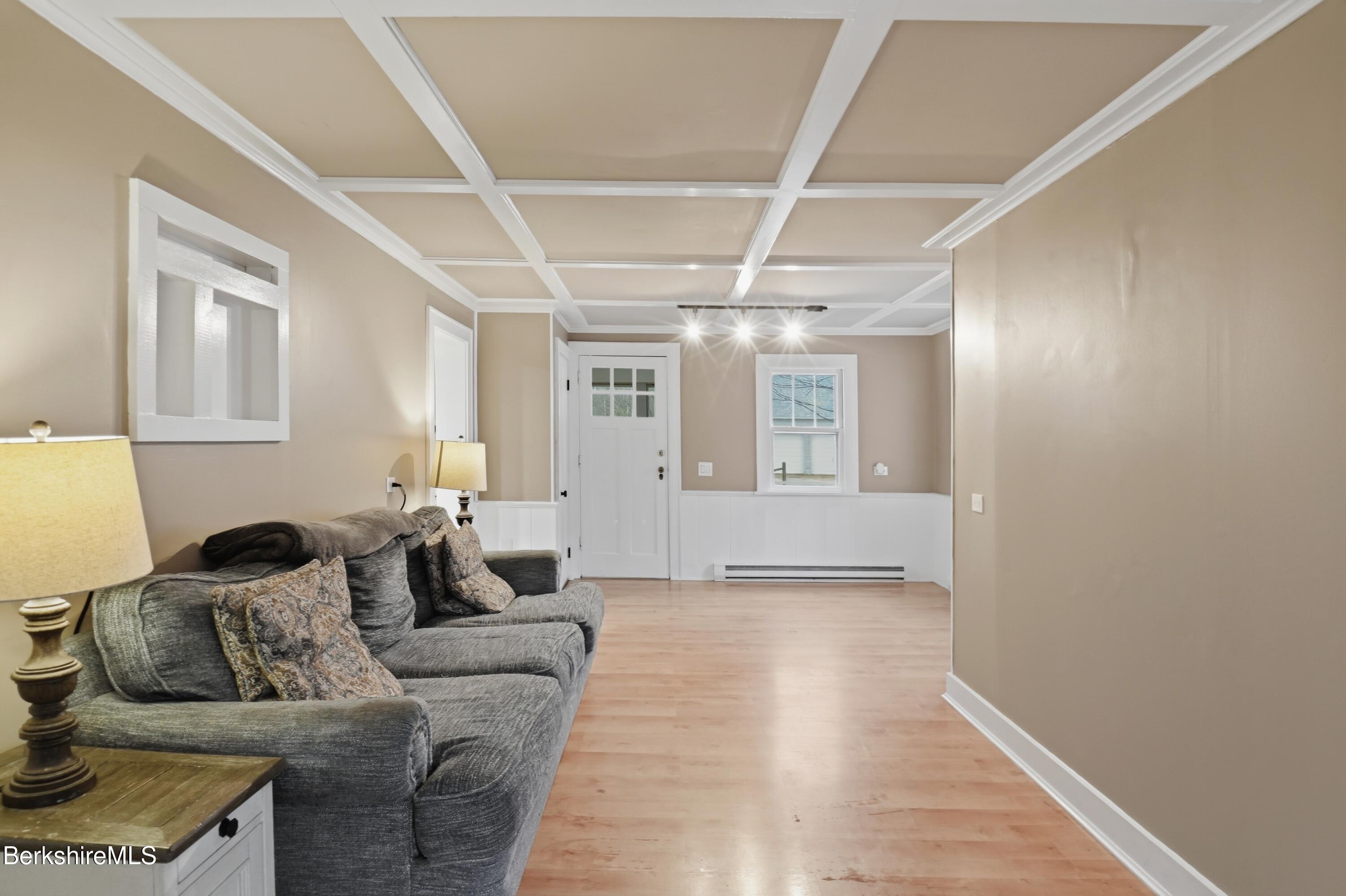 117 Norfolk Road New Marlborough, MA 01259 - Photo 21 of 59 a living room with furniture and a chandelier