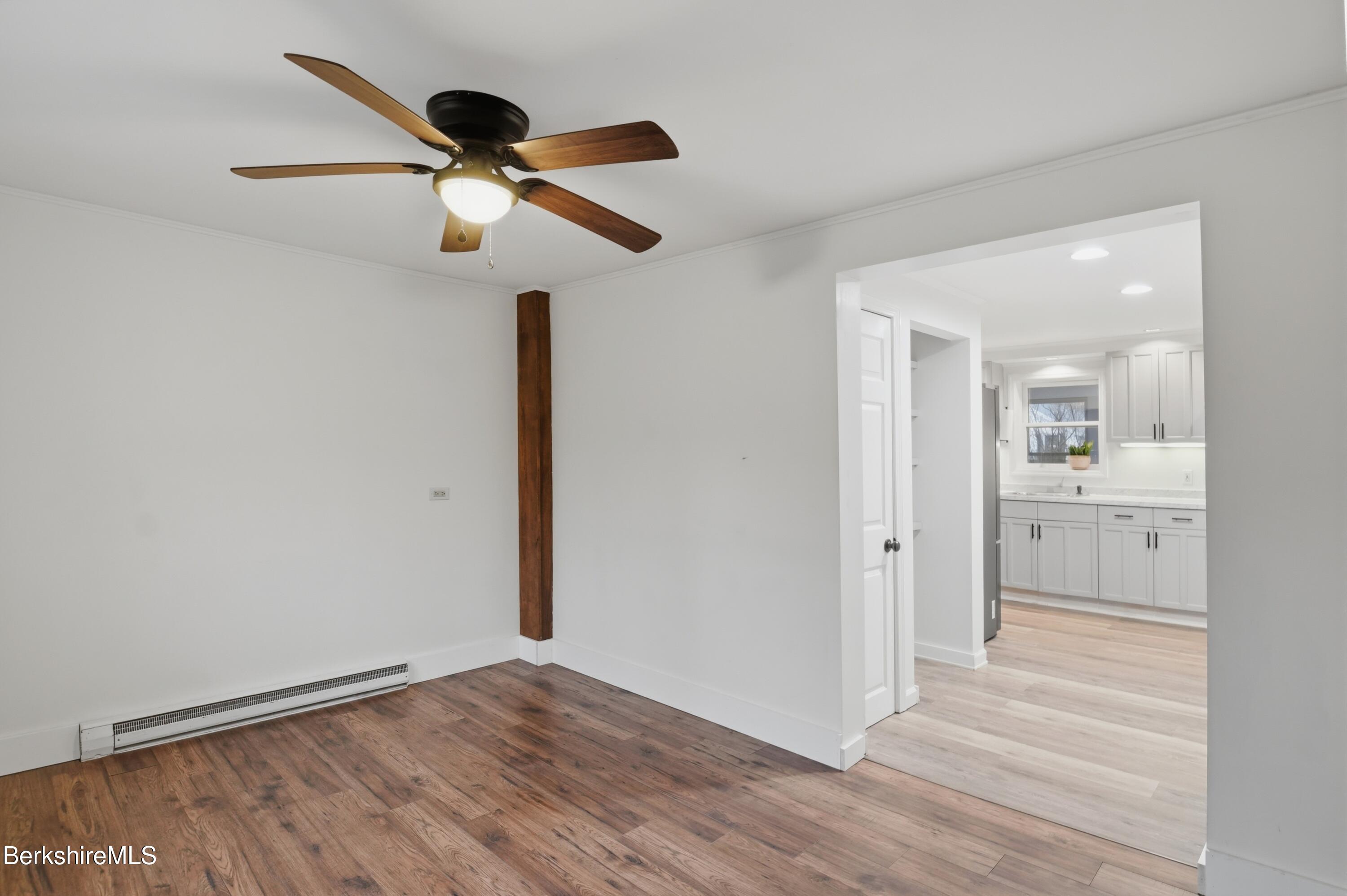 117 Norfolk Road New Marlborough, MA 01259 - Photo 26 of 59 a view of a room with wooden floor and ceiling fan