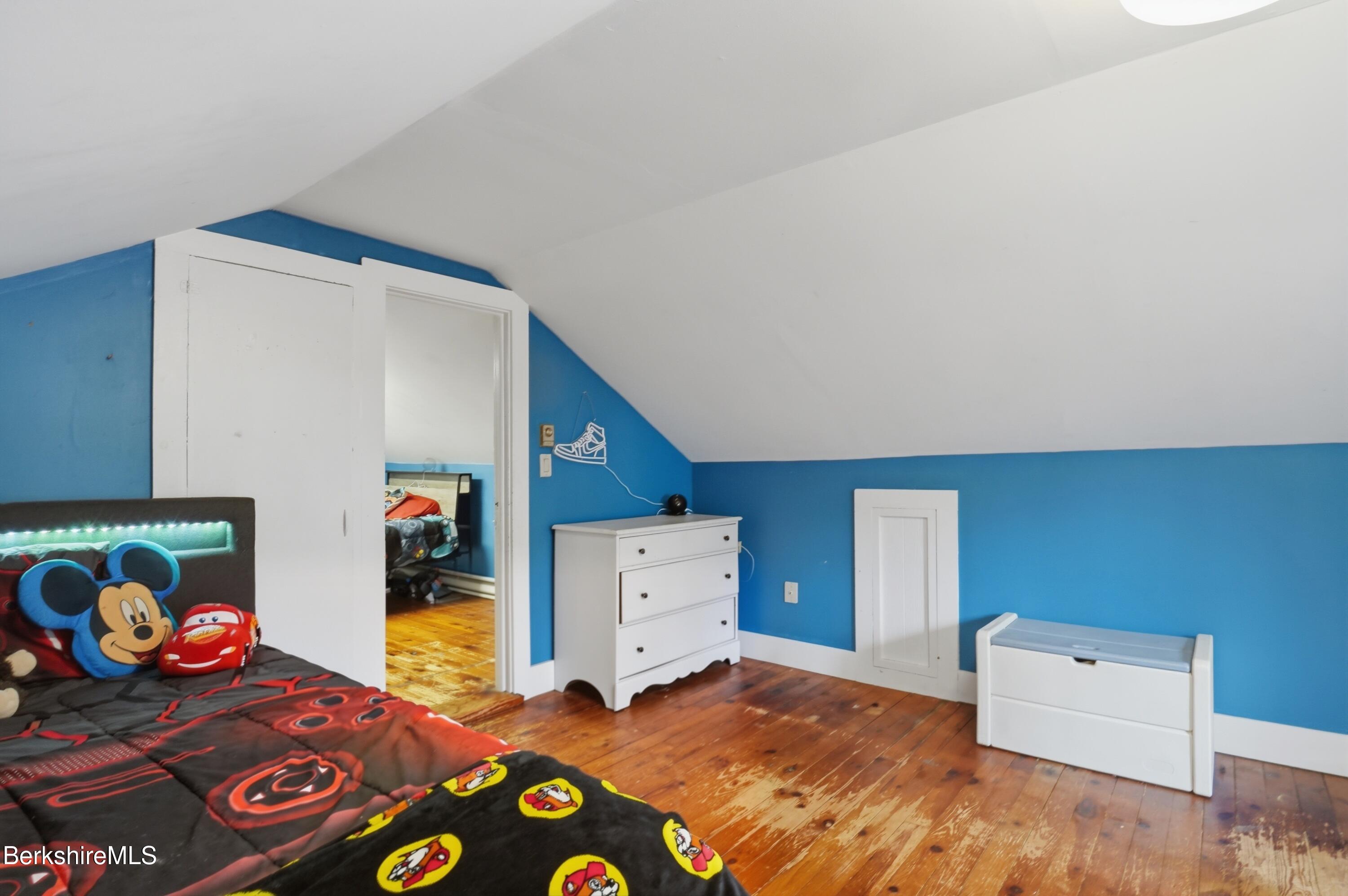 117 Norfolk Road New Marlborough, MA 01259 - Photo 33 of 59 a bedroom with a bed and cabinets