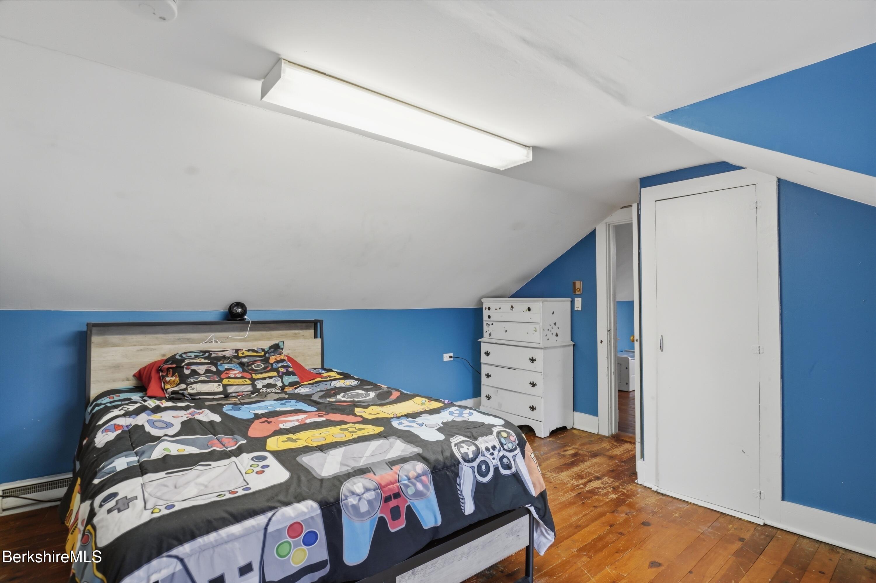 117 Norfolk Road New Marlborough, MA 01259 - Photo 36 of 59 a bedroom with a bed and dresser