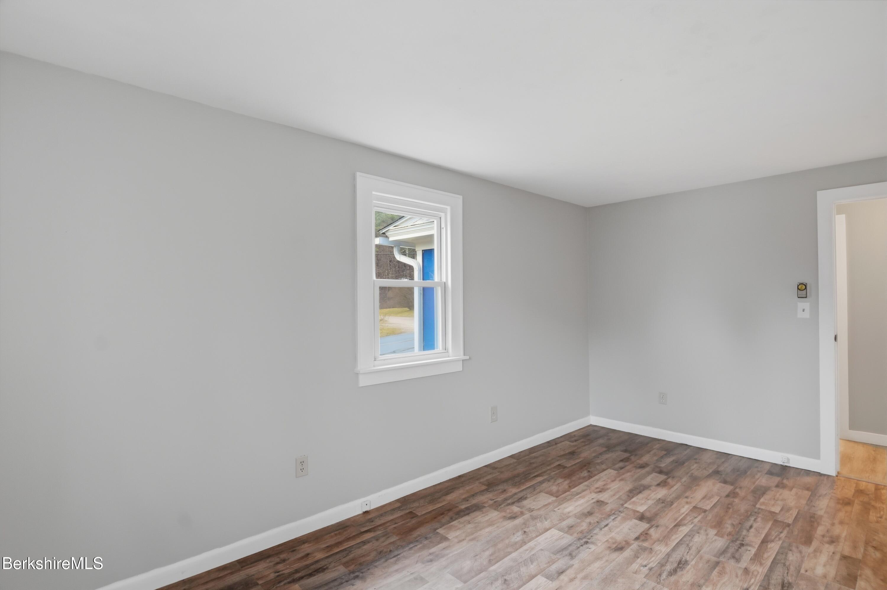 117 Norfolk Road New Marlborough, MA 01259 - Photo 42 of 59 wooden floor in an empty room with a window