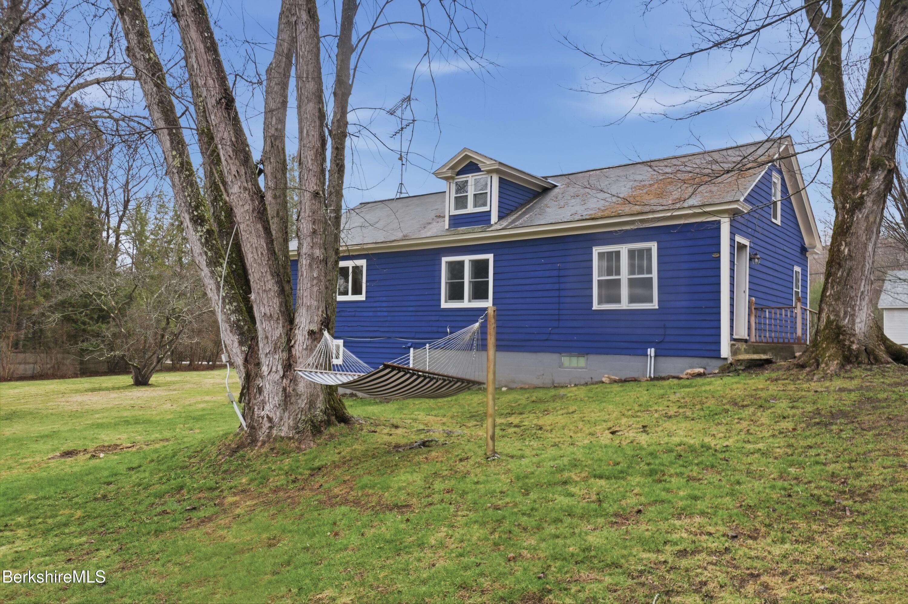117 Norfolk Road New Marlborough, MA 01259 - Photo 49 of 59 a view of a brick house with a yard