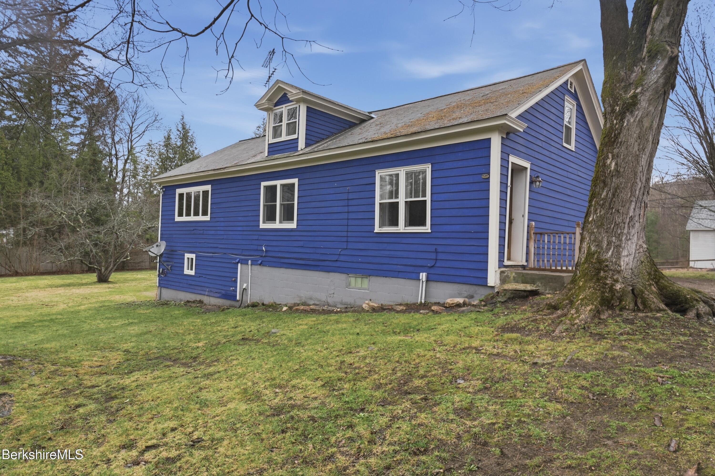117 Norfolk Road New Marlborough, MA 01259 - Photo 50 of 59 a view of a brick house with a yard