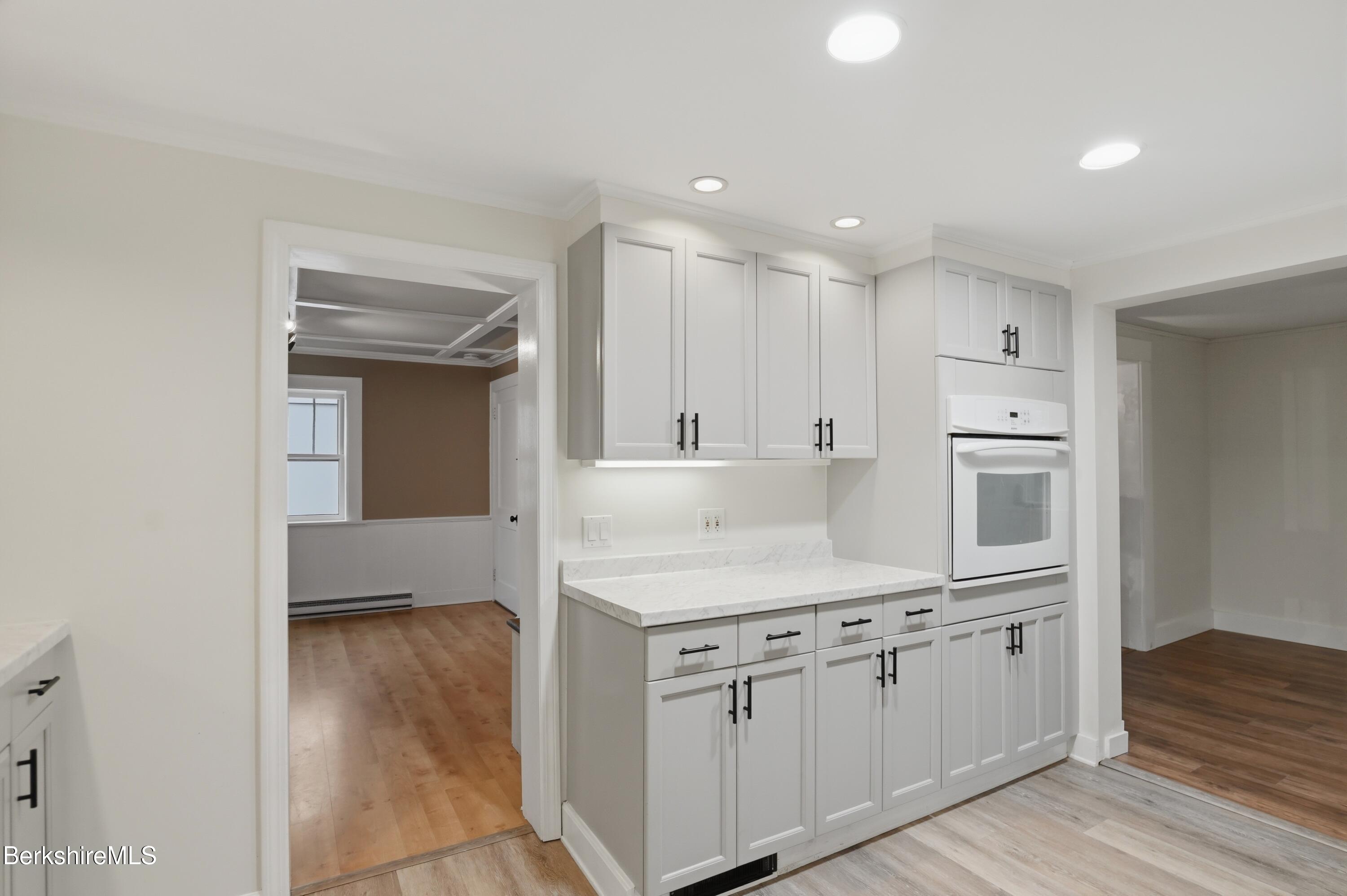 117 Norfolk Road New Marlborough, MA 01259 - Photo 7 of 59 a kitchen with a sink microwave and cabinets