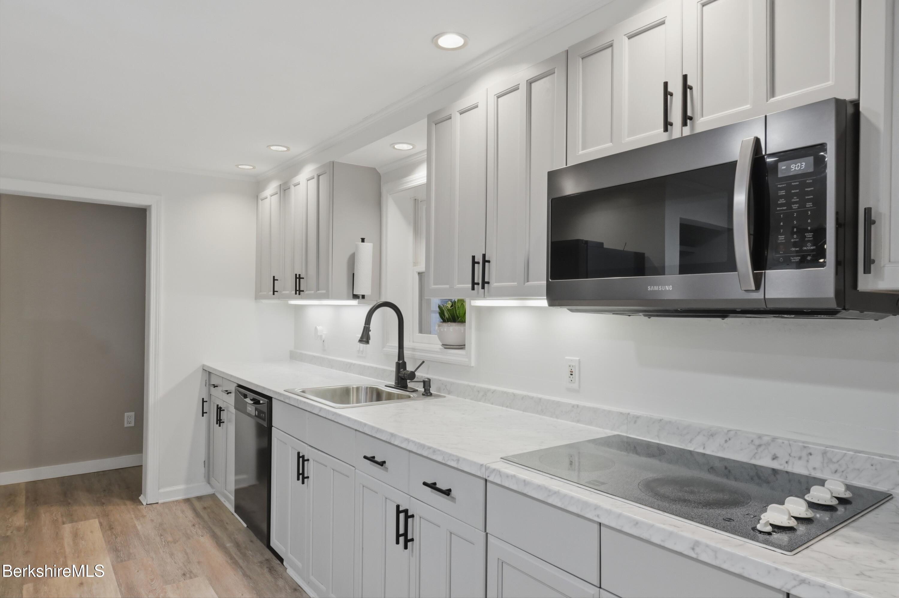 117 Norfolk Road New Marlborough, MA 01259 - Photo 9 of 59 a kitchen with a sink and cabinets