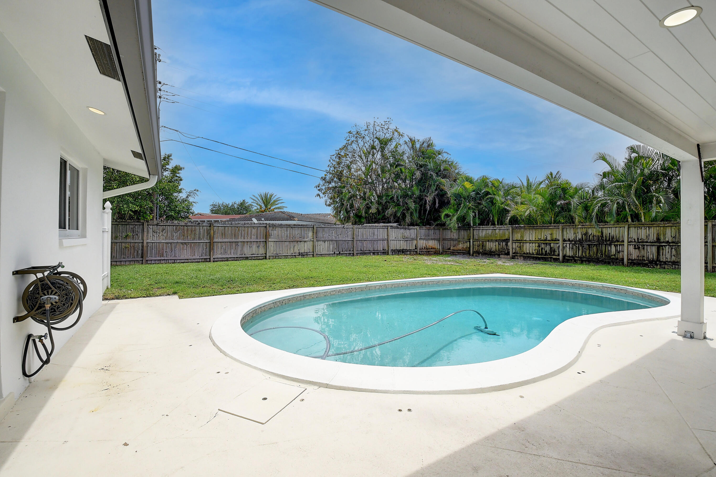 798 Southwest 15th Avenue Boca Raton, FL 33486 - Photo 2 of 27 a view of outdoor space yard swimming pool and outdoor kitchen
