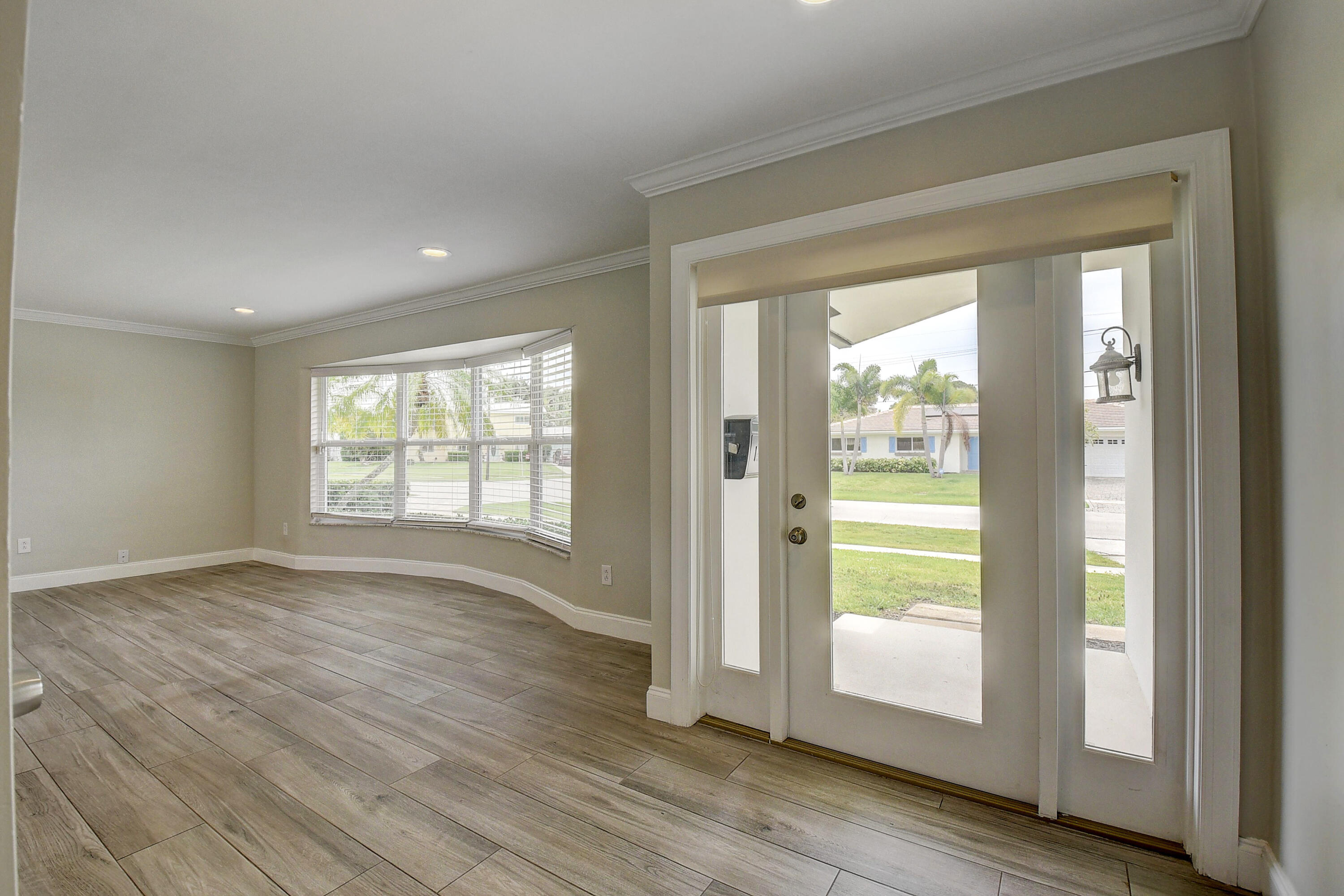 798 Southwest 15th Avenue Boca Raton, FL 33486 - Photo 3 of 27 a view of an empty room and glass door