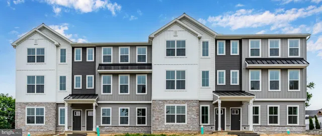 a front view of residential houses with street