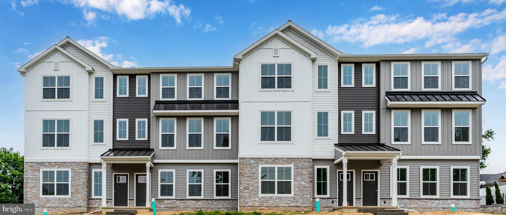 a front view of residential houses with street
