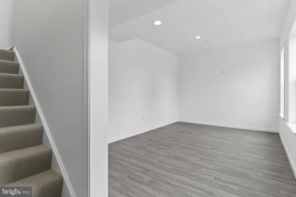 a view of an entryway with wooden floor