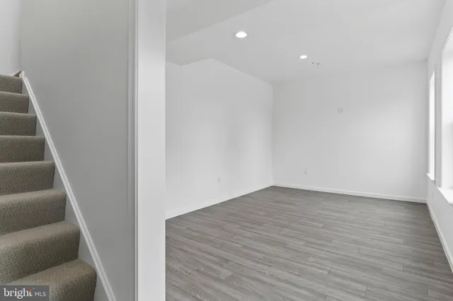a view of an entryway with wooden floor
