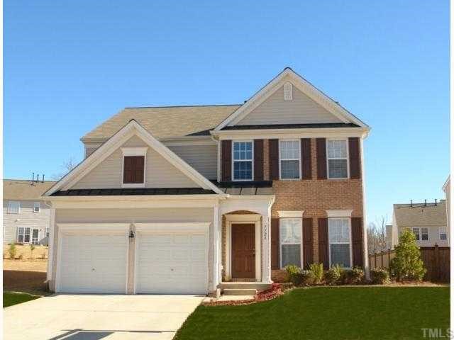 7728 Jackson Dane Drive Raleigh, NC 27613 - Photo 1 of 8 a front view of a house with a yard