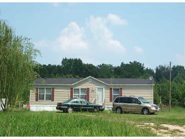 3430 Green Path Road Dunn, NC 28334 - Photo 1 of 1 a car parked in front of a house with a yard