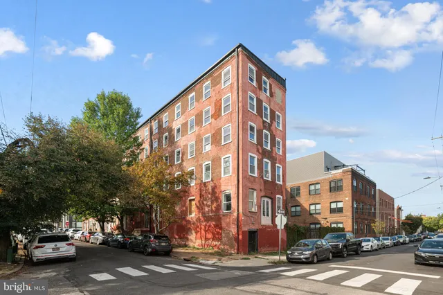 a view of a street with cars