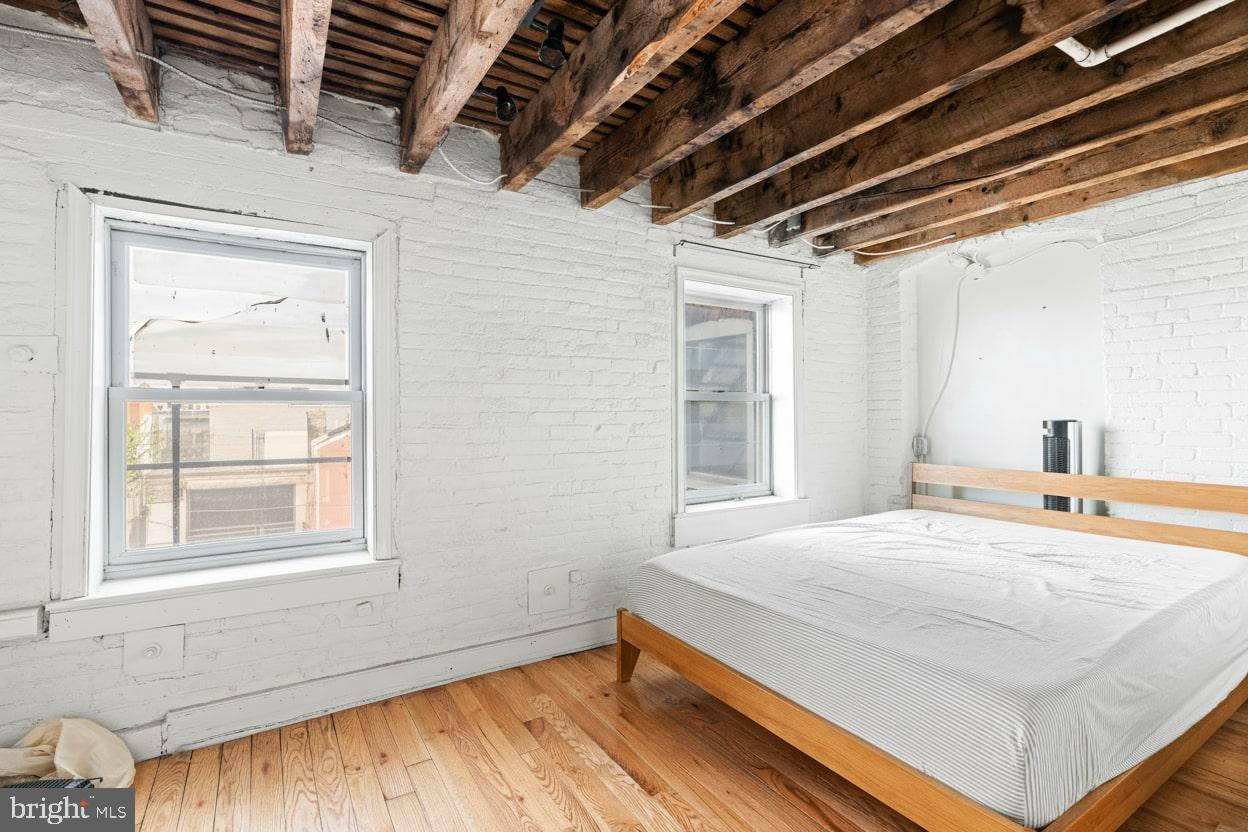 153 West Jefferson Street Philadelphia, PA 19122 - Photo 17 of 31 a bedroom with a bed and a window