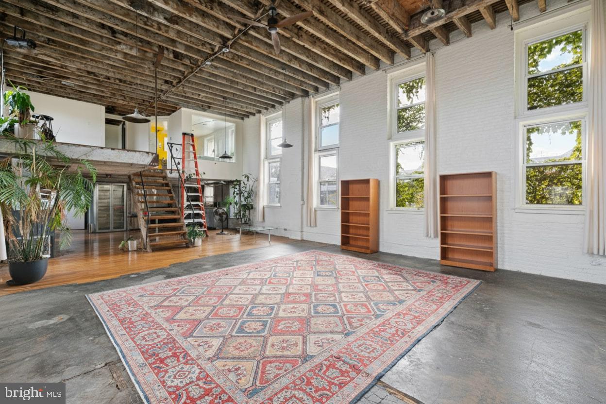 153 West Jefferson Street Philadelphia, PA 19122 - Photo 8 of 31 an empty room with wooden floor and windows