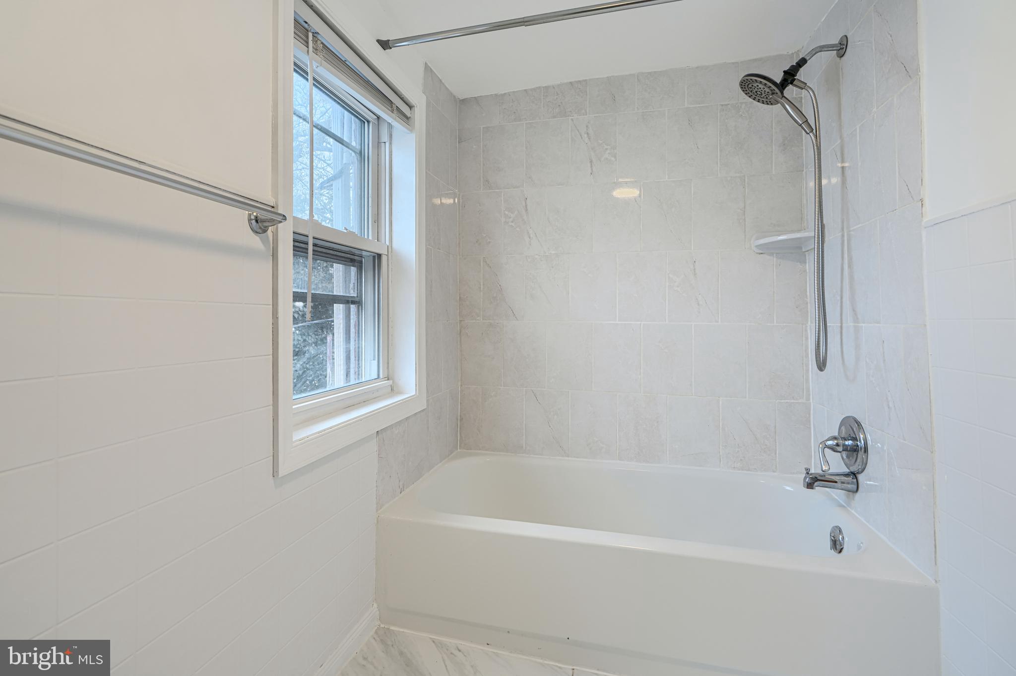 2015 Spark Court Baltimore, MD 21231 - Photo 12 of 12 a bathroom with a bathtub and a shower